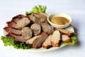 Assortment of meat slices with mustard, dishes of Russian national cuisine