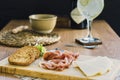 Assortment of meats, bread, and beverages on a table, Italian aperitif Royalty Free Stock Photo