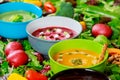 Assortment multi colored soups of vegetable cream soup on ingredients for soup background