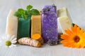 Assortment of natural soaps with medicinal plants, flowers and turmeric