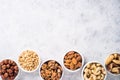 Nuts assortments on stone table top view. Royalty Free Stock Photo