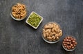 Assortment nuts and pumpkin seeds arranged diagonally on a gray background with copy space Royalty Free Stock Photo