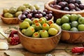 Assortment of olives in wooden bowl