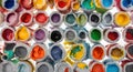 Assortment of Open Paint Cans with Various Colors