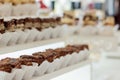 Assortment of pieces of cake on messy table, copy space. Several slices of delicious desserts, restaurant menu concept, top view