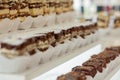 Assortment of pieces of cake on messy table, copy space. Several slices of delicious desserts, restaurant menu concept, top view