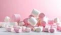 Assortment of Pink and White Marshmallows Scattered on White Surface with Pink Background Royalty Free Stock Photo