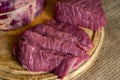 Assortment of raw beef on wooden chopping board Royalty Free Stock Photo