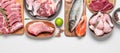Assortment of raw fresh meat on gray pastel background. Beef, pork, fish, chicken and duck. Top view, flat lay. Wide Royalty Free Stock Photo