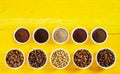 Assortment of roasted and raw coffee in bowls Royalty Free Stock Photo