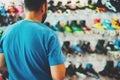 Assortment roller skates isolated in store shop, person choosing and buy color roller-skates on backgraund sun flare Royalty Free Stock Photo