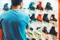 Assortment roller skates isolated in store shop, person choosing and buy color roller-skates on backgraund sun flare, healthy and Royalty Free Stock Photo