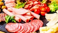 Assortment of salami prosciutto meats and sausages, olives and spices.Meat appetizer.Different types of sausages with Royalty Free Stock Photo