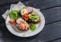 Assortment of sandwiches - sandwiches with cheese, radish, cucumber, quail egg, avocado and smoked salmon. Royalty Free Stock Photo