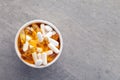 Assortment scattered pharmaceutical medicine tablets, pills, drugs in wooden bowl on gray background. White food dietary Royalty Free Stock Photo