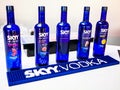 Assortment of Skyy Vodka bottles displayed on a white surface Royalty Free Stock Photo