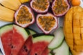 Assortment of sliced tropical fruits on plate. Royalty Free Stock Photo