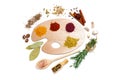 Assortment of spices on a polish for artist paints, on a white background, top view, horizontal, no peope