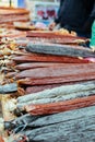 Assortment of spicy dried or smoked beef and pork salami, sausages, chorizo. Various kind types of salami and sausages in market, Royalty Free Stock Photo