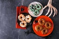 Assortment of Halloween donuts. Above view table scene on a dark background. Royalty Free Stock Photo