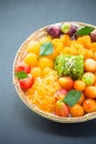 An assortment of sweet thai desserts on black background