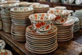 Assortment of tableware and serveware stacked on a wooden table Royalty Free Stock Photo