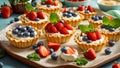 assortment tartlets cream, strawberries, cake blueberries natural nutrient summer party