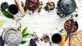 Assortment of tea, cups and teapots on white wooden background. Chinese Tea Ceremony. Top view.