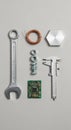 An assortment of tools and components arranged neatly on a gray background. The Royalty Free Stock Photo