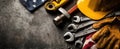 The assortment of tools and safety gear on a rugged work surface. AI generated image Royalty Free Stock Photo
