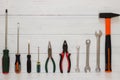 Assortment of tools on wood texture background. Hammer, wrenches, screwdrivers and pliers on white background with copyspace