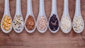 Assortment of traditional thai rice in spoon on wooden background. The Supper food high Fiber and vitamin E for dietary and