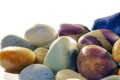 Assortment of tumbled beach pebbles studio shot against white ba Royalty Free Stock Photo