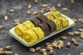 Assortment of Turkish delight with pistachio on a dark background. Royalty Free Stock Photo