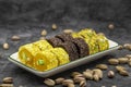 Assortment of Turkish delight with pistachio on a dark background. Royalty Free Stock Photo