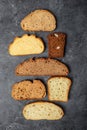 assortment of types of bread. cut into slices, vertical image. top view. place for text Royalty Free Stock Photo