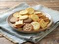 A delightful assortment of crispy crackers arranged on a rustic plate atop burlap cloth and wooden table. Generative AI