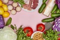 an assortment of vegetables and meats on a pink background Royalty Free Stock Photo