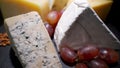 An assortment of wine appetizers, appetizers or gourmet dinners. Top view, close distance, a wedge of cheese, on a rare Royalty Free Stock Photo