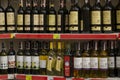 An assortment of wines on a supermarket shelf with price tags Royalty Free Stock Photo