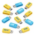 Assortment of Yellow and Blue USB Flash Drives Scattered on White Surface Keywords: USB drive, flash drive, storage, memory, data Royalty Free Stock Photo