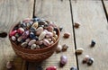 Assortment of young legumes and beans of different varieties and colors in a clay bowl. Raw food. Healthy diet concept. Selective Royalty Free Stock Photo