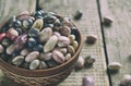 Assortment of young legumes and beans of different varieties and colors in a clay bowl. Raw food. Healthy diet concept. Selective Royalty Free Stock Photo