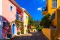 Assos village in Kefalonia, Greece. Turquoise colored bay in Mediterranean sea with beautiful colorful houses in Assos village in