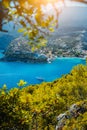 Assos village, Kefalonia. Greece. White yacht in blue bay framed by nature. Turquoise colored bay in Mediterranean sea Royalty Free Stock Photo