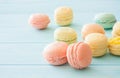 Assotrment of macarons on blue wood background