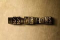 ASSUMPTIONS - close-up of grungy vintage typeset word on metal backdrop Royalty Free Stock Photo