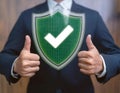 Assurance and confidence, featuring elements like a checkmark, shield, and thumbs up, symbolizing trust, security, and positive Royalty Free Stock Photo