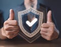 Assurance and confidence, featuring elements like a checkmark, shield, and thumbs up, symbolizing trust, security, and positive Royalty Free Stock Photo