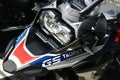 Assymetrical headlights, front mudguard and windshield on dual sport german motorcycle BMW 1250 GS. Royalty Free Stock Photo